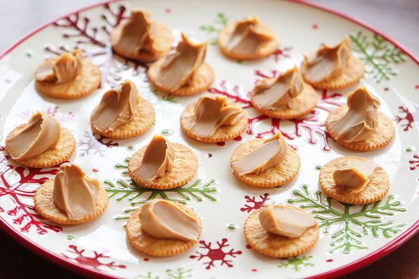 Ritz Cookies — Ritz Crackers stuffed with Peanut Butter dipped in White Chocolate