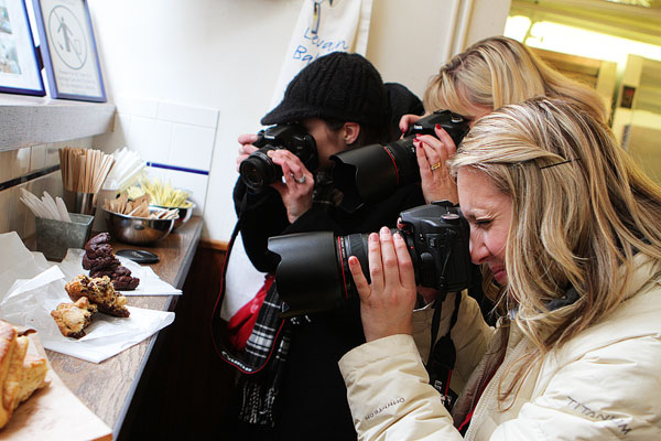 Image of Women Taking Photos of Food