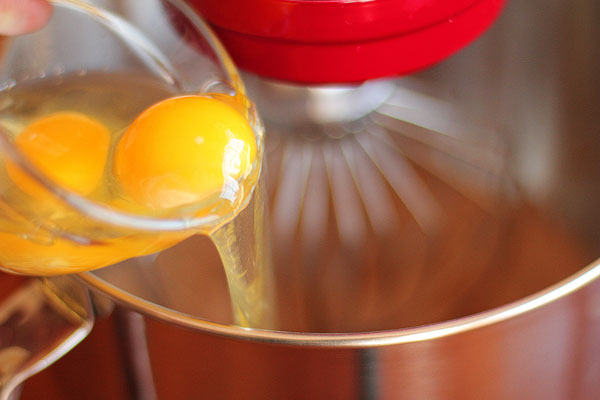 Image of Eggs being Poured into a Mixing Bowl