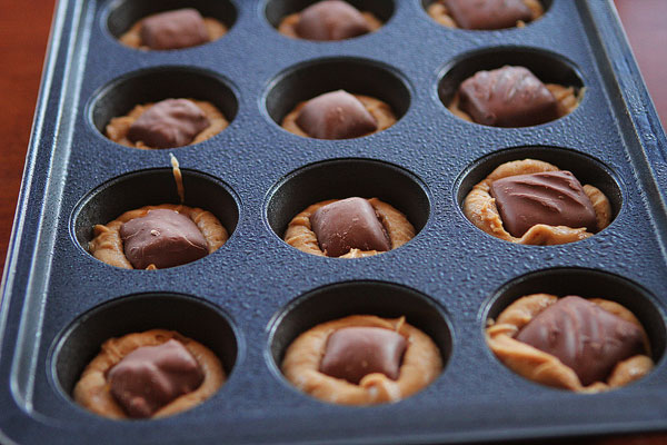 Frosted Candy Bar Stuffed Cookie Cups