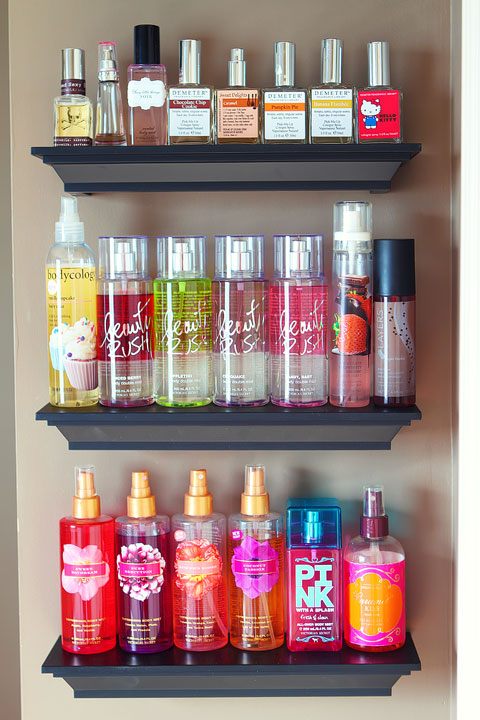Easy DIY Bathroom Organization! Use crown molding to make shelves to organize perfumes, lotions, hairspray, etc. Neat, organized, and right at your fingertips! From kevinandamanda.com 