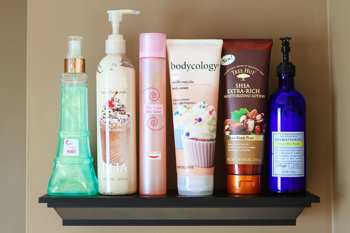 Easy DIY Bathroom Organization! Use crown molding to make shelves to organize perfumes, lotions, hairspray, etc. Neat, organized, and right at your fingertips! From kevinandamanda.com 