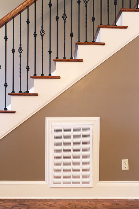 Turn that blank wall under the stairs into a photo gallery wall!