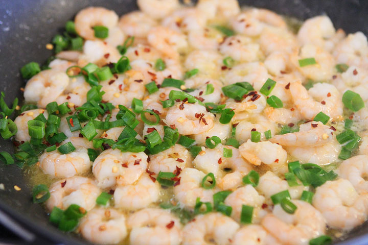 Linguine with shrimp, avocado, & parmesan cheese. Season with salt, pepper, and red pepper flakes. Easy dinner, done!