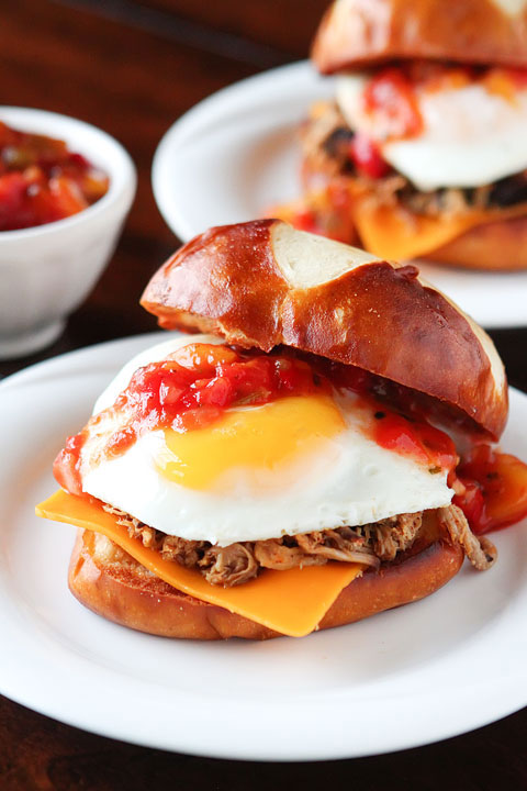 All I can say is WOW! Spicy pulled pork topped with a bright mango-peach salsa, a fried egg and served on a fresh pretzel bun.