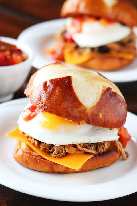 All I can say is WOW! Spicy pulled pork topped with a bright mango-peach salsa, a fried egg and served on a fresh pretzel bun.