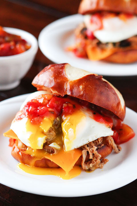 All I can say is WOW! Spicy pulled pork topped with a bright mango-peach salsa, a fried egg and served on a fresh pretzel bun.