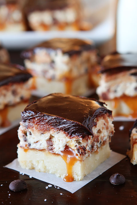 Cookie Dough Billionaire Bars. The most amazing dessert you can bring to a potluck ever. 4 Layers of Shortbread, Salted Caramel Sauce, Cookie Dough, and homemade Chocolate Ganache.