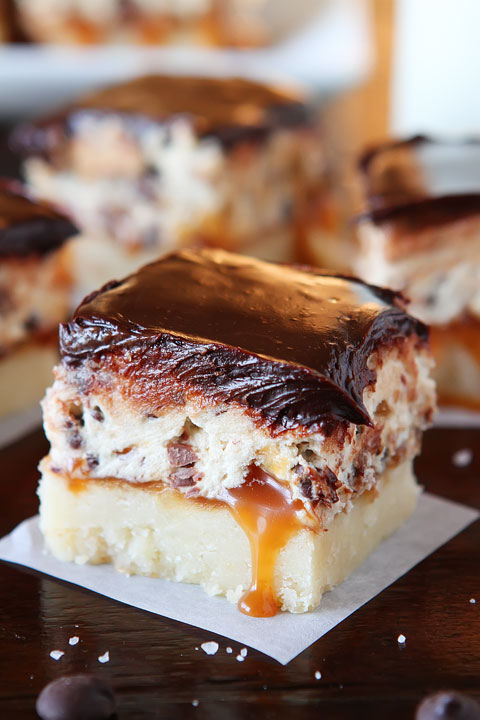 Cookie Dough Billionaire Bars. The most amazing dessert you can bring to a potluck ever. 4 Layers of Shortbread, Salted Caramel Sauce, Cookie Dough, and homemade Chocolate Ganache.