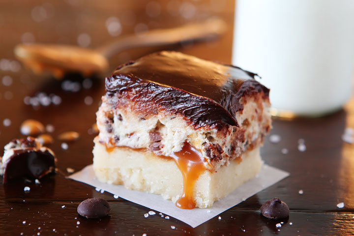 Cookie Dough Billionaire Bars. The most amazing dessert you can bring to a potluck ever. 4 Layers of Shortbread, Salted Caramel Sauce, Cookie Dough, and homemade Chocolate Ganache.