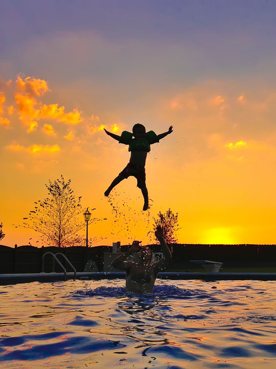 Image of a Child's Silhouette During Sunset