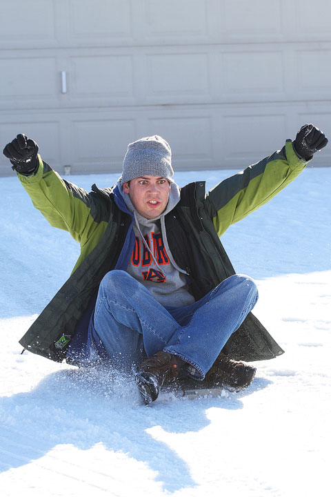 Image of Kevin Sledding in The Snow