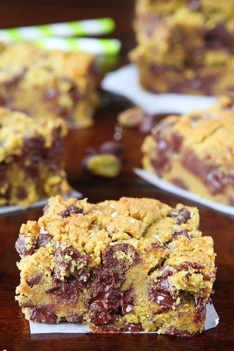 Lucky Leprechaun Bars! So good, they're sure to attract a Leprechaun and his pot of gold. ;) Dark chocolate, pistachio butter, and sea salt come together to make this perfect chewy cookie bar. Make these the next time you need a little luck in your day!