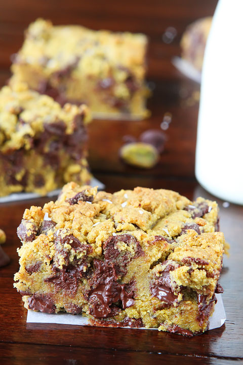 Lucky Leprechaun Bars! So good, they're sure to attract a Leprechaun and his pot of gold. ;) Dark chocolate, pistachio butter, and sea salt come together to make this perfect chewy cookie bar. Make these the next time you need a little luck in your day!