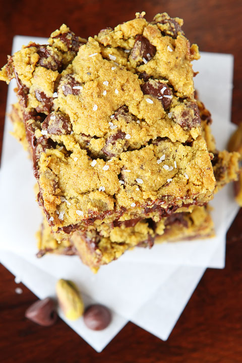 Lucky Leprechaun Bars! So good, they're sure to attract a Leprechaun and his pot of gold. ;) Dark chocolate, pistachio butter, and sea salt come together to make this perfect chewy cookie bar. Make these the next time you need a little luck in your day!