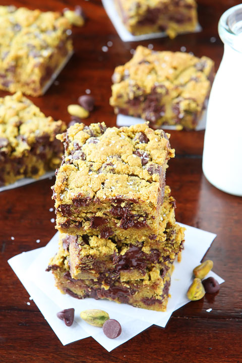 Lucky Leprechaun Bars! So good, they're sure to attract a Leprechaun and his pot of gold. ;) Dark chocolate, pistachio butter, and sea salt come together to make this perfect chewy cookie bar. Make these the next time you need a little luck in your day!