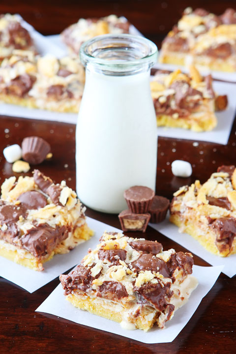 Gooey Ritz Peanut Butter Cup S'mores Bars! Buttery cake topped with marshmallow fluff, mini peanut butter cups and Ritz crackers. If these bars were a person, we'd be married and on our third kid.