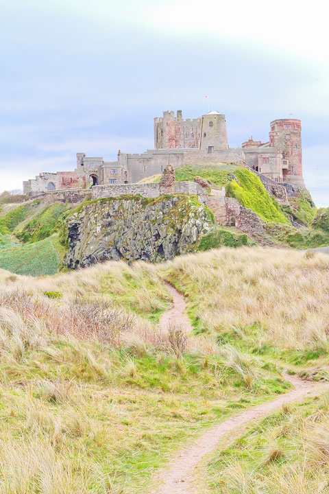 Visit Bamburgh Castle on a castle drive down the coast of Scotland + More Tips for Traveling to Scotland from www.kevinandamanda.com.