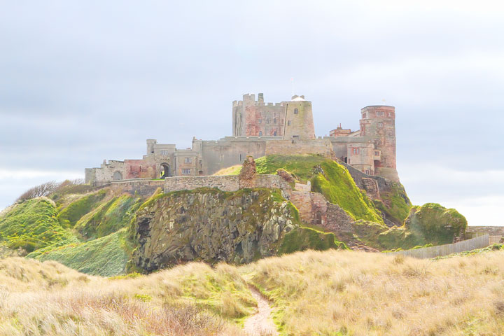 Visit Bamburgh Castle on a castle drive down the coast of Scotland + More Tips for Traveling to Scotland from www.kevinandamanda.com.