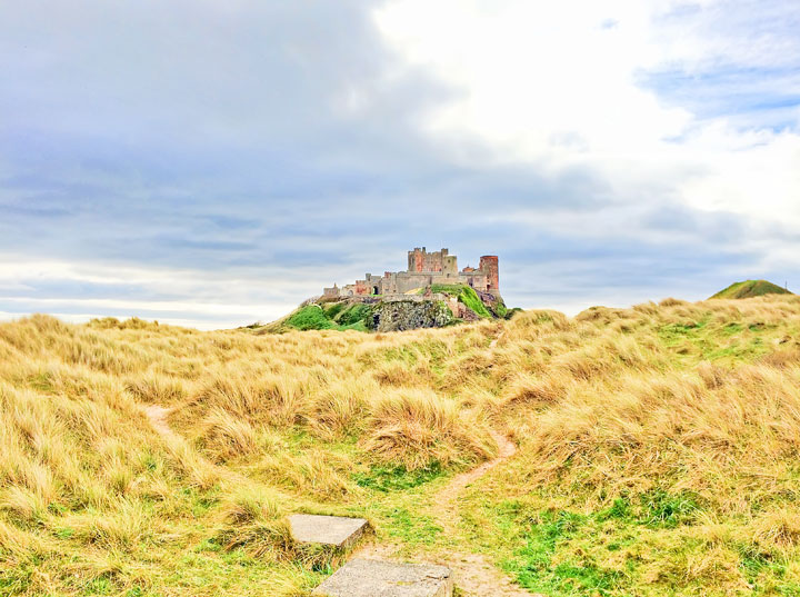 Visit Bamburgh Castle on a castle drive down the coast of Scotland + More Tips for Traveling to Scotland from www.kevinandamanda.com.