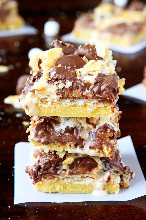 Gooey Ritz Peanut Butter Cup S'mores Bars! Buttery cake topped with marshmallow fluff, mini peanut butter cups and Ritz crackers. If these bars were a person, we'd be married and on our third kid.