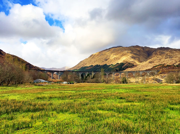 Glenfinnan Viaduct from Harry Potter + Tips for Traveling to Scotland. What to Do, See, & Eat. www.kevinandamanda.com