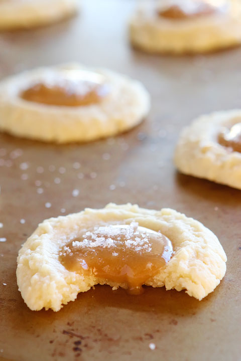 These Salted Caramel Cookies are SO soft and buttery. The perfect vanilla butter cookie! But topped with gooey salted caramel?? I die!! 