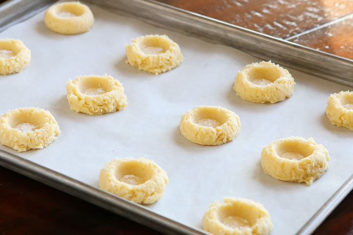 These Salted Caramel Cookies are SO soft and buttery. The perfect vanilla butter cookie! But topped with gooey salted caramel?? I die!! 