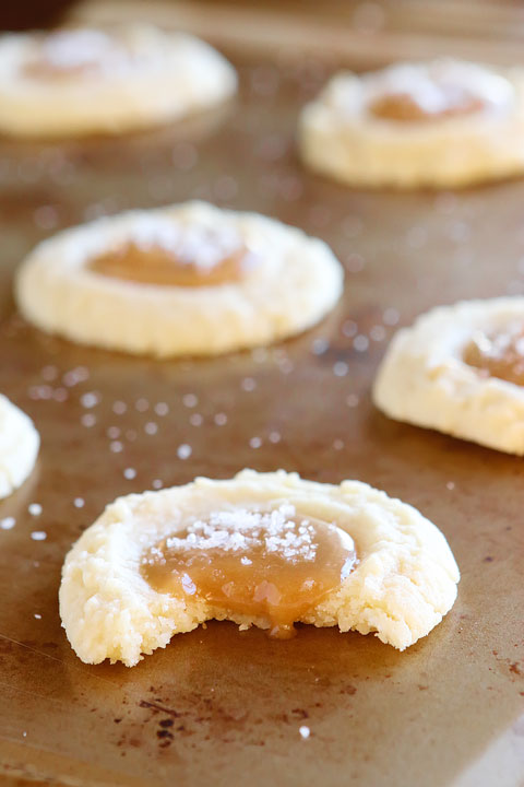 These Salted Caramel Cookies are SO soft and buttery. The perfect vanilla butter cookie! But topped with gooey salted caramel?? I die!! 