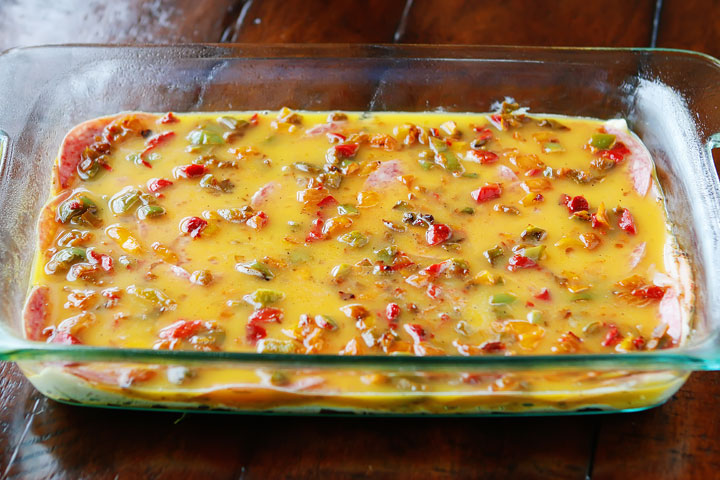 An easy, cheesy, Italian Breakfast Casserole. Layer crescent rolls, ham, salami, eggs, bell peppers and cheese, then bake for 30 mins. Perfect for breakfast, lunch, or breakfast for dinner!