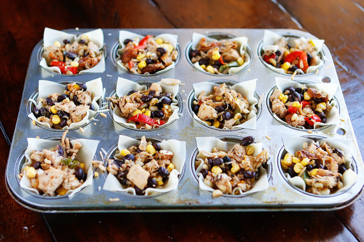 Make these fun Southwestern Chicken Cups using Wonton Wrappers in a Muffin Tin! Great for using up leftover rotisserie chicken or boneless, skinless chicken breasts. 