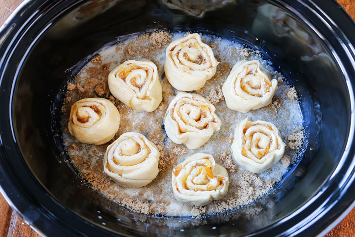 Make these Orange Sweet Rolls are made in a Crock-Pot for an ULTRA soft and gooey bun!! Plus you can keep them warm in the Crock-Pot so they always taste fresh out of the oven.