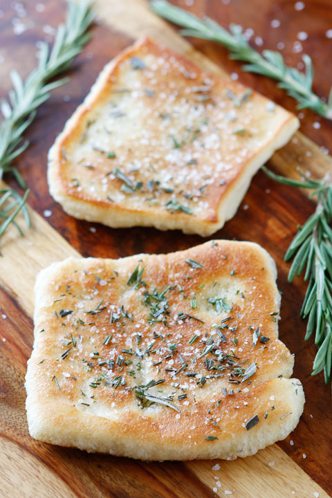 The PERFECT appetizer or side dish to serve with dinner! This bread is SO quick and easy to whip up. It's lightly fried in olive oil and topped with fresh rosemary and sea salt. The perfect combination!! You have to make this!!