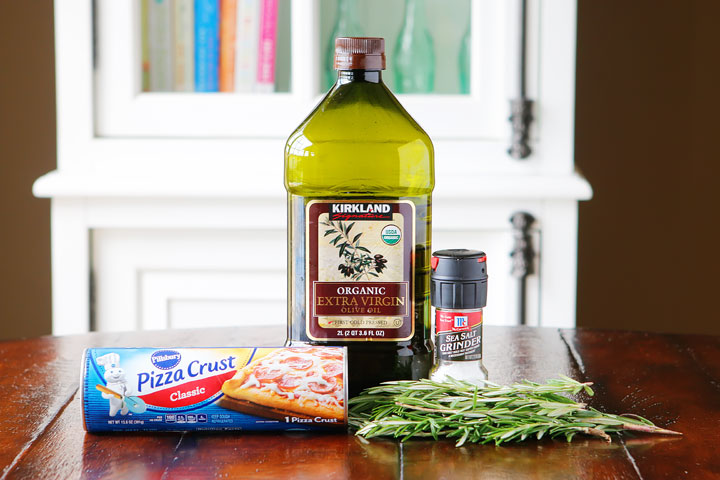 The PERFECT appetizer or side dish to serve with dinner! This bread is SO quick and easy to whip up. It's lightly fried in olive oil and topped with fresh rosemary and sea salt. The perfect combination!! You have to make this!!