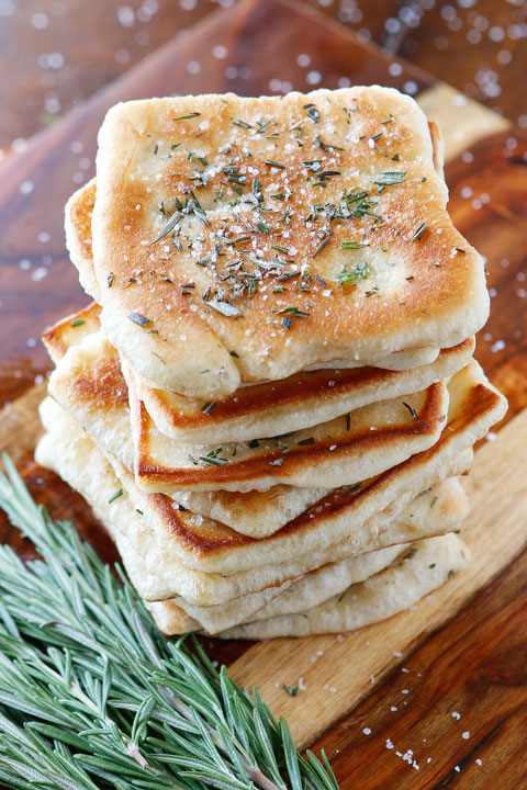 The PERFECT appetizer or side dish to serve with dinner! This bread is SO quick and easy to whip up. It's lightly fried in olive oil and topped with fresh rosemary and sea salt. The perfect combination!! You have to make this!!