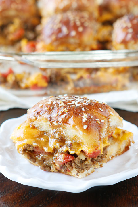 These Cheesy Party Burgers are so fun! Great to serve to a crowd or just to make dinner fun. Perfect for parties because you can make them the night before and cook the next day. If you want to start the party, make these Cheesy Party Burgers!!