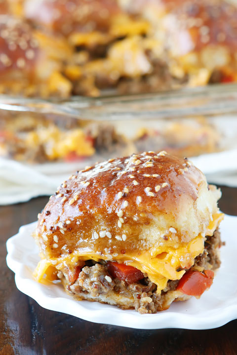 These Cheesy Party Burgers are so fun! Great to serve to a crowd or just to make dinner fun. Perfect for parties because you can make them the night before and cook the next day. If you want to start the party, make these Cheesy Party Burgers!!