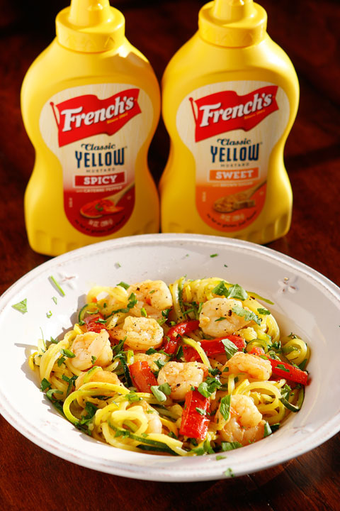 The PERFECT summer recipe!! Sautéed shrimp and red bell peppers poured over a bed of spiralized zucchini and yellow squash. So easy and delicious!