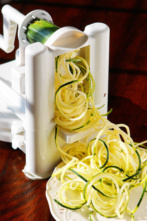 The PERFECT summer recipe!! Sautéed shrimp and red bell peppers poured over a bed of spiralized zucchini and yellow squash. So easy and delicious!