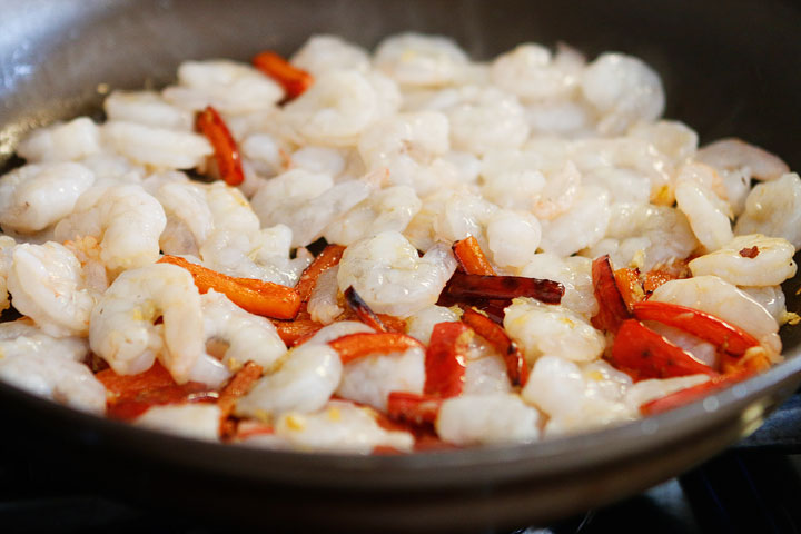 The PERFECT summer recipe!! Sautéed shrimp and red bell peppers poured over a bed of spiralized zucchini and yellow squash. So easy and delicious!