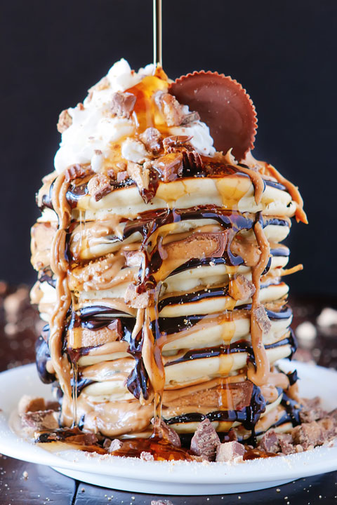 OMG These Reese's Chocolate Peanut Butter Cup Pancakes are UNREAL!!! Love this giant stack of pancakes!!