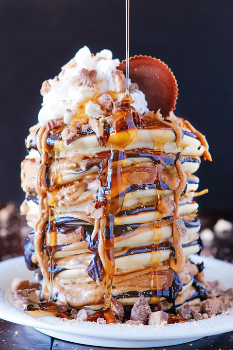 OMG These Reese's Chocolate Peanut Butter Cup Pancakes are UNREAL!!! Love this giant stack of pancakes!!