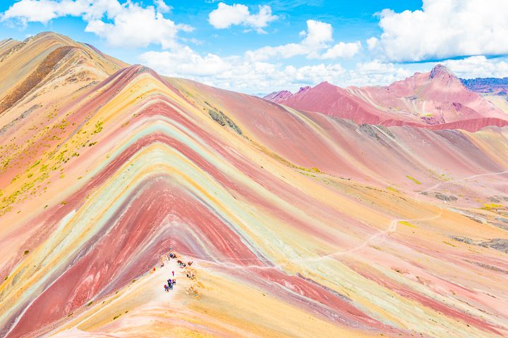 Rainbow Mountain, Peru. Don't go at 3 AM with the tour groups. Sleep in, miss the crowds, and have Rainbow Mountain all to yourself! Read this post for everything you need to know about hiking Rainbow Mountain in Peru. 