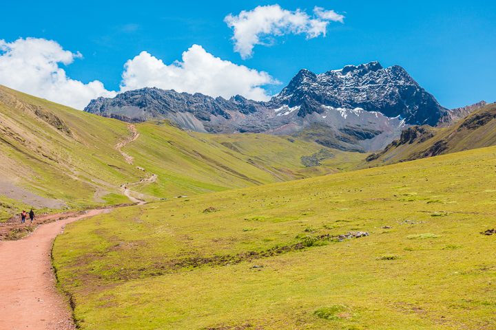 Rainbow Mountain, Peru. Don't go at 3 AM with the tour groups. Sleep in, miss the crowds, and have Rainbow Mountain all to yourself! Read this post for everything you need to know about hiking Rainbow Mountain in Peru.