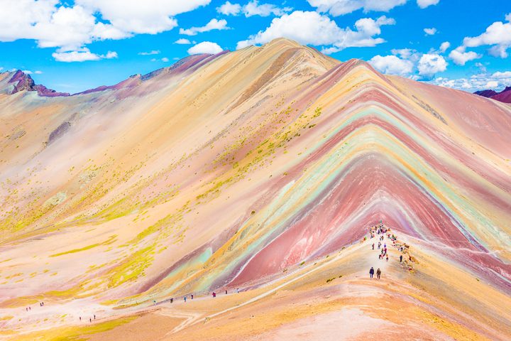 Rainbow Mountain, Peru. Don't go at 3 AM with the tour groups. Sleep in, miss the crowds, and have Rainbow Mountain all to yourself! Read this post for everything you need to know about hiking Rainbow Mountain in Peru.