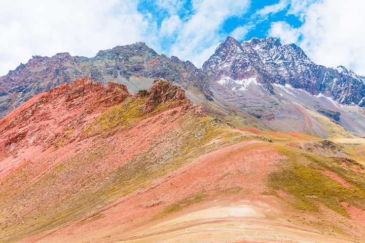 Rainbow Mountain, Peru. Don't go at 3 AM with the tour groups. Sleep in, miss the crowds, and have Rainbow Mountain all to yourself! Read this post for everything you need to know about hiking Rainbow Mountain in Peru.