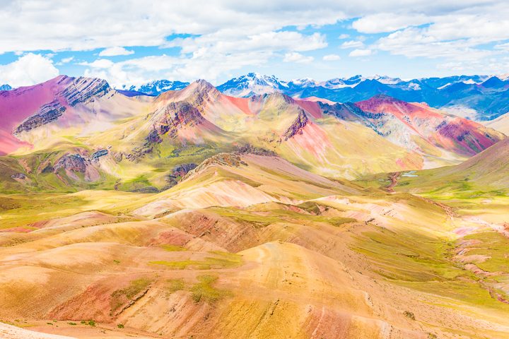 Rainbow Mountain, Peru. Don't go at 3 AM with the tour groups. Sleep in, miss the crowds, and have Rainbow Mountain all to yourself! Read this post for everything you need to know about hiking Rainbow Mountain in Peru.