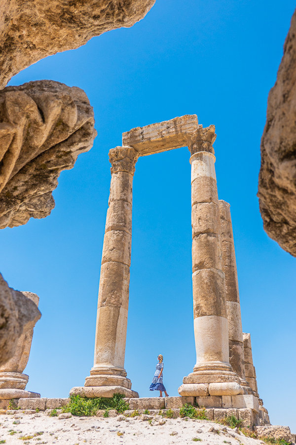 Girl standing between columns at Amman Citadel