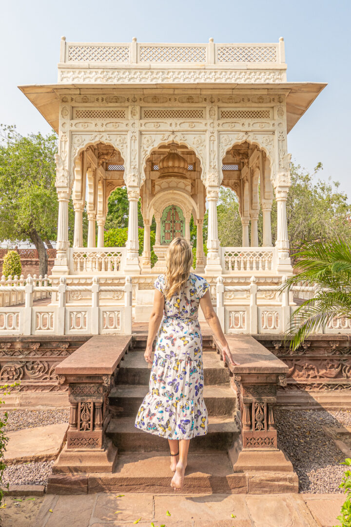 Woman standing in front of a gazeebo in Jodhpur, India