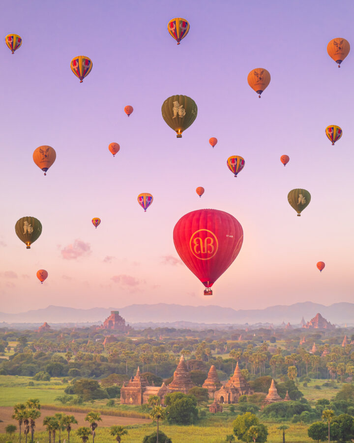 Colorful hot air balloons over Bagan, Myanmar at sunrise.
